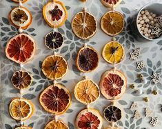 oranges and other fruits are arranged on a table