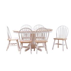 a white table and four chairs sitting next to each other