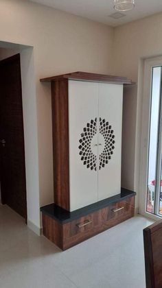 a cabinet in the middle of an empty room