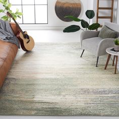 a living room with a guitar on the floor