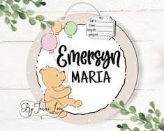 a wooden sign that says, emerson maria with a teddy bear and balloons