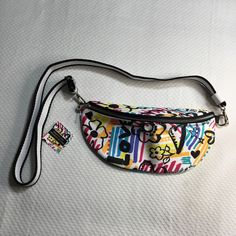 Brighton Belt Bag Graffiti Love Crossbody Belt 12.5” Nwt Adjustable Strap 38” Zip Front Excellent Condition White Shoulder Bag With Zipper Pouch For On-the-go, White Casual Bag With Cell Phone Pocket, Casual White Bag With Cell Phone Pocket, White Crossbody Bag With Zipper Pouch, White Zipper Pouch Shoulder Bag For On-the-go, Trendy Multicolor Bag With Zipper Pouch, Fun Multicolor Bags With Removable Pouch, Fun Bags For Everyday Use In Spring, Fun Everyday Use Spring Bag