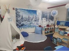 a child's playroom with toys and decorations on the walls, including a teepee tent