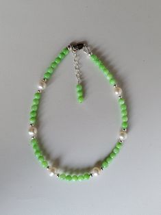 This anklet is mainly made of mint green colored Mother-of-Pearl, Sterling Silver, and Freshwater Pearl beads. The anklet has a 1" beaded extension making it adjustable.  Custom Orders are always welcome! Ask about free sizing. Elegant Green Anklet For Gifts, Elegant Green Anklets For Gift, Green Pearl Beaded Bracelets, Green Beaded Anklets With Round Beads, Green Beaded Pearl Bracelet, Providence Ri, Green Mint, White Freshwater Pearl, Anklet Jewelry