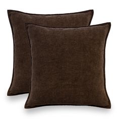 two brown pillows sitting next to each other