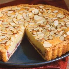 a pie with almonds is on a plate