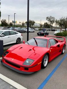 a red sports car parked in a parking lot