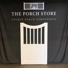 the porch store unique porch components is displayed in front of a black backdrop with white doors