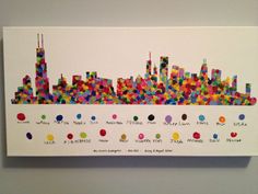 a colorful cityscape is displayed on the wall