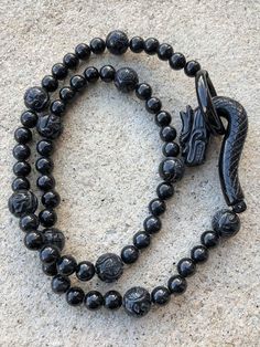 Vintage Translucent Natural Black Jadeite Jade Carved Dragon Clasp Bead Necklace ....Total of weights 92.1grams...Measure 23'' Length With 60 Beads Black Jade 8 to 12MM ...It's in very good condition. Black Agate Gemstone Beads, Spiritual Obsidian Beaded Jewelry, Spiritual Obsidian Round Bead Jewelry, Obsidian Beaded Jewelry For Healing, Spiritual Obsidian Jewelry With Round Beads, Black Agate Round Beads Necklace, Polished Round Obsidian Bead Jewelry, Obsidian Round Beads Jewelry 8mm, Round Obsidian Jewelry With Black Beads