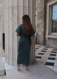 PRODUCT DETAILS: Satin midi dress in dark green Short sleeve Waist tie Functional buttons True to size Minimal stretch Length: 55" 95% Polyester, 5% Spandex Model 1 is wearing a Small Model 1 Info: Height: 5'3", Bust: 36 3/4". Waist: 30", Hips: 38.5" Model 2 is wearing a size Medium Model 2 Info: Height: 5'6", Bust: 41", Waist: 34, Hips: 41" Fitted V-neck Midi Dress In Dark Green, Fitted Dark Green Midi Dress With V-neck, Fitted Dark Green V-neck Midi Dress, Green Midi Dress For Office, Formal Green Stretch Midi Dress, Formal Green Ruched Midi Dress, Green Stretch Midi Dress, Green Midi Dress For Work, Green Short Sleeve Maxi Dress For Work