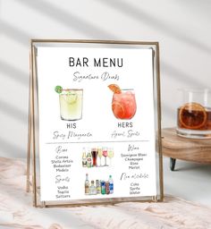 a bar menu with drinks on the table