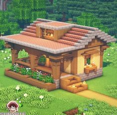 a small wooden house in the middle of a lush green field with flowers and trees