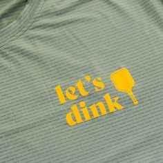 the words let's drink are painted on a t - shirt