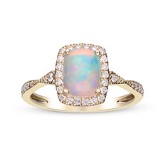 an opal and diamond ring in yellow gold with white diamonds on the sides,