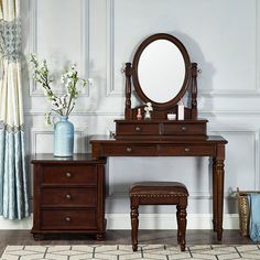 a dressing table with a mirror and stool