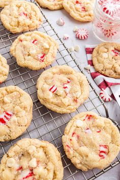 peppermint white chocolate chip cookies cooling on a wire rack with candy canes