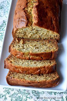 sliced loaf of banana bread on a white plate