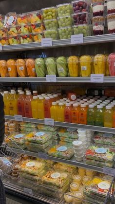 a display in a store filled with lots of juice