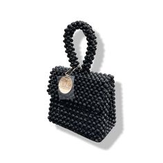 Artisanal Bead Bag.Designed in NYC. Crafted with precision in the heart of Lagos, Nigeria.Introducing our exclusive bead bags – the epitome of timeless elegance and craftsmanship. Chic, streamlined, and adaptable, these handbags are designed to be your enduring companions. Effortlessly blending style and durability, our bead bags transcend trends, seamlessly complementing cocktail dresses, casual denim and tees, professional attire, and becoming the perfect accessory for a night out on the town.