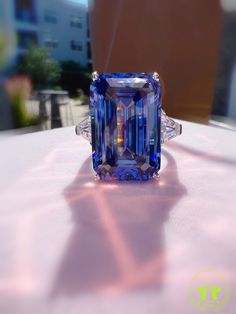 29 Carat Emerald Cut Three Stone ROYAL Blue SAPPHIRE Simulant Ring Fabulous Anniversary Engagement Ring S925/14K/18K The Mainstone size is 13*20mm (29 Carat) Made to order ♥925 SILVER WITH 18KGP ♥ The main stone is the finest Lab-Grown Sapphire  ♥Absolutely gorgeous and beautifully handcrafted Lab-Grown Sapphire Ring in solid 925 Sterling Silver. ♥ This classic yet trendy Ring makes the perfect Christmas/Anniversary/Valentine's/Birthday gift for her that will be treasured forever. We have confid Luxury Hallmarked Blue Rings, Blue Gia Certified Emerald Ring For Formal Occasions, Blue Tanzanite Emerald Cut Ring, Luxury Blue Tanzanite Ring, Luxury Royal Blue Rings For Anniversary, Luxury Blue Oval Emerald Ring, Formal Blue Emerald Ring In Fine Jewelry Style, Blue Emerald Ring For Formal Occasions, Gia Certified Blue Jewelry For Gift