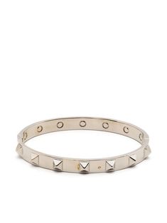 Rockstud embellished bangle from VALENTINO GARAVANI featuring silver-tone, brass, signature Rockstud detailing and push-lock fastening. Valentino Bracelet, Valentino Rock Stud Bracelet, Valentino Rockstud Ballerina, Valentino Rockstud Spike Bag, Valentino Studded Bag, Bangle Silver, Cartier Love Bracelet, Valentino Garavani, Silver Bracelet