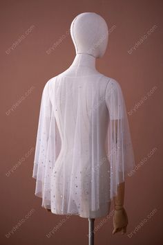 Shiny rhinestones spread on the soft tulle. Take this statement Trendy Shiny Rhinestones Tulle Bridal Cape for Sale to bring some shimmer to your wedding day. Available for wholesale. shown color white sold by the piece content nylon, PET detail rhinestones weight light weight elasticity no length front-45cm, back- 60cm washing instructions hand wash/drip dry * Free size for bust circumference under 125cm. Elegant Sparkling Tulle Fabric For Wedding, Elegant Wedding Veil Made Of Net, Elegant Net Wedding Veil, Elegant Wedding Veil In Net Material, Elegant Wedding Veil In Net, Glitter Tulle Fabric With Sequins For Wedding, White Tulle Bridal Accessories For Evening, Embellished Tulle Fabric For Wedding, Wedding Glitter Tulle Fabric