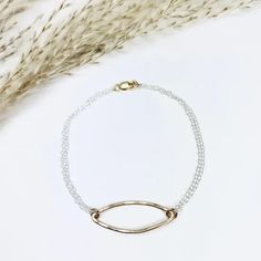 This simplistic bracelet blends a classic marquis shape with a modern, mixed metal, minimalist, design. From our Geo Labradorite Collection. #mixedmetals #handcraftedjewelry #timeless •14k gold filled with sterling silver chain •Shape Dimensions: about 1 x .25" •Length: 7.25" Metal Minimalist, Sterling Silver Chain, Sterling Silver Chains, Labradorite, Minimalist Design