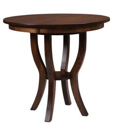 a round wooden table with curved legs