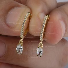 Genuine Solitaire Oval Cut Diamond Drop Huggie Hoop Earrings In Solid 14K Yellow Gold Pave Diamond Wedding Earrings Handmade Jewelry * SKU: SE01468 * Made to Order * Gold Purity: 14K Solid Yellow/ Rose/ White Gold (stamped) * Custom Gold Color: Rose Gold, Yellow Gold, White Gold * Custom Gold Purity: 9K/14K/18K (Charges Apply) * Diamond 100% Genuine Diamond * Small Diamond wt: 0.18 Ct. (Round) * Oval Diamond wt: 0.50 Ct. (0.25 ct Each Diamond) * Diamond Color: G-H * Diamond Clarity: SI1- SI2 * D Formal 14k Gold Hoop Earrings With Bail, White Gold Dangle Huggie Earrings For Wedding, 14k Gold Hallmarked Hoop Earrings For Wedding, Yellow Gold Hallmarked Huggie Earrings For Wedding, Diamond Cut Dangle Huggie Earrings For Anniversary, Wedding Diamond Dangle Huggie Earrings, Classic Dangle Hoop Earrings For Anniversary, Huggie Earrings With Lever Back For Wedding, Formal 14k Gold Dangle Huggie Earrings