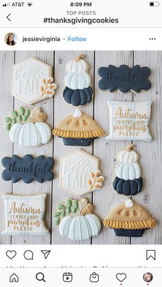 cookies decorated to look like pumpkins and fall leaves are displayed on a wooden table