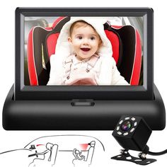 a baby is sitting in a car seat with the monitor on it's side