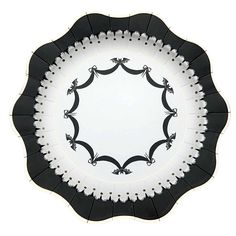 a black and white plate with an ornate design on the rim is shown against a white background