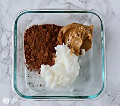 three different types of food in a glass container on a marble counter top, including mashed potatoes and chocolate