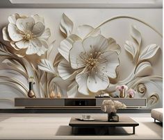 the living room is decorated with white flowers and gold swirls on it's wall