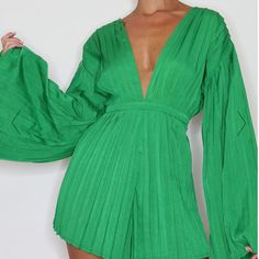 Inject Some Bright Colors Into Your Collection With This Plt Romper. Featuring An Emerald Green Satin Poly Material With Pleated Detail, A Plunging Neckline And A Wide Angel Sleeve Design. Perfect Transitional Piece For Summer And Vacations! Open Back With Tie-Neck. New With Maker Tags Attached Size 6 Chic Green V-neck Jumpsuit, Green V-neck Jumpsuits And Rompers For Spring, Spring Green V-neck Jumpsuits And Rompers, Green Fitted V-neck Jumpsuit, Green Long Sleeve Jumpsuits And Rompers For Party, Green V-neck Jumpsuits For Night Out, Green Long Sleeve Party Jumpsuits, Summer Party Long Sleeve Jumpsuits And Rompers, Summer Party Jumpsuits And Rompers With Long Sleeves