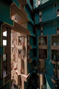 the inside of a building with many windows and balconies on each floor, as seen from above