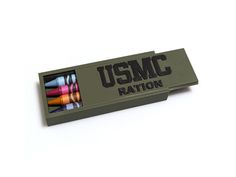 an army green box filled with crayons and the words usmc written on it