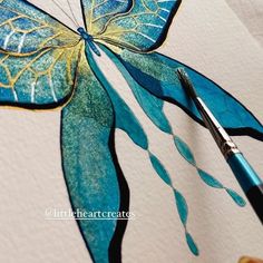 a painting of a blue butterfly being painted