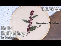 a cross stitch pattern with holly embroidery on it and the words holly embroidery written in red