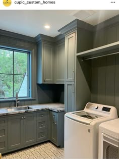 a washer and dryer sitting in a kitchen next to a window