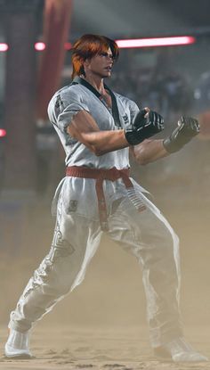 a man with red hair holding a baseball bat in his hand while standing on a field