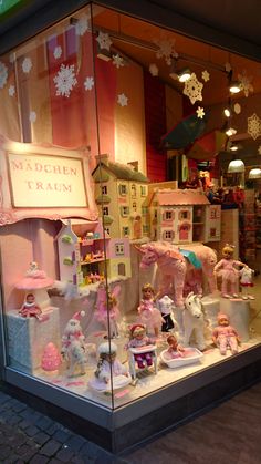 a window display with dolls and toys in it