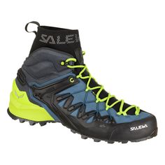 a pair of black and blue hiking boots with yellow laces on the outstep