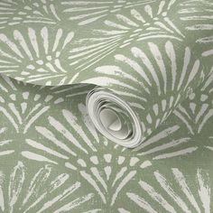 a green and white wallpaper with an intricate design on it's surface,