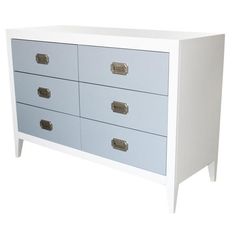 a white and blue chest of drawers with metal handles on each drawer, against a white background