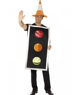 a man in a costume holding up a traffic light sign