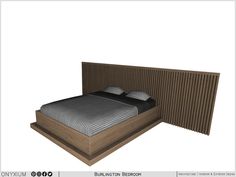 a bed sitting next to a wooden headboard