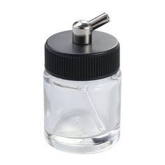 a glass jar with a black lid and a metal spigot on the top