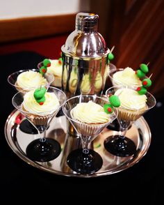 cupcakes in martini glasses on a silver tray